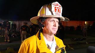 HFD: Firefighter escapes injury after falling through roof during house fire