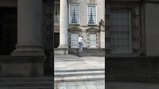 Skateboarder does trick from ledge of building then board hits him on a sensitive area and popsicles