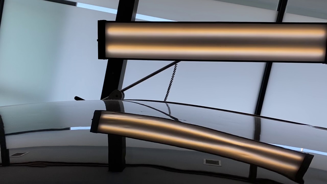 Fixing extreme hail damage on a Kia Sedona roof.