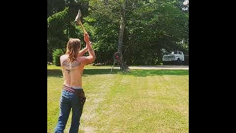 Man Does a Double Rotation Axe Throw Hitting Bull