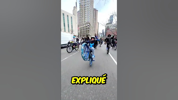 Homme aide un garçon à faire une roue arrière 🚲❤️