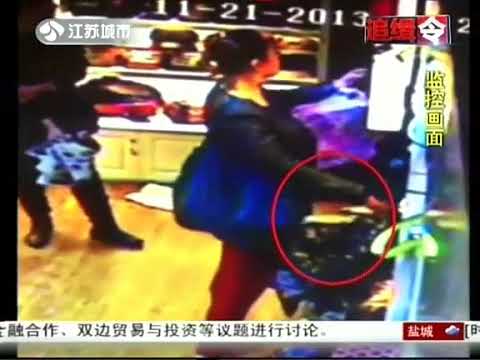 female thief steals wallet from the woman's purse