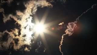 Sun Burst Between Erie Clouds Time Lapse - Royalty Free HD Stock Video Footage.