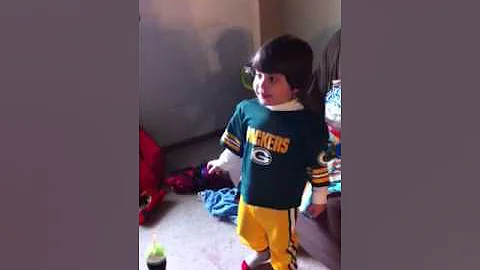 Cute three year old boy singing
