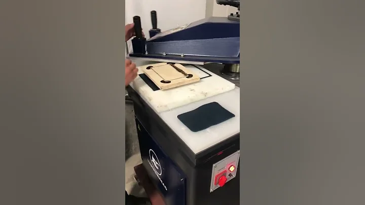 Cutting leather wallets w lace holes on a 10 Ton HAMMERHEAD Swing Arm Clicker Press