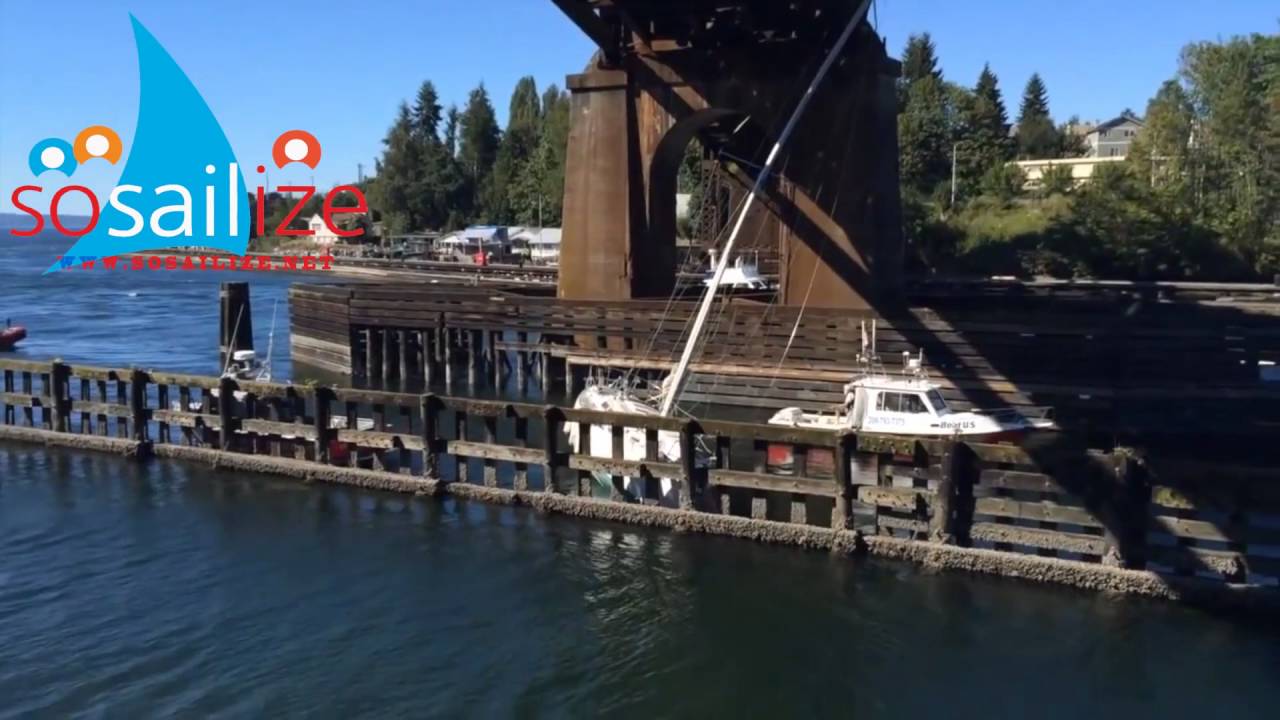 sailboat stuck under bridge