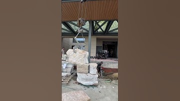 Teamwork Makes Big Stone Installation Easy #teamwork #construction #masonry #building #heavywork