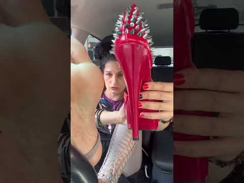 Pedal pumping red platforms with one fishnet on and one barefoot