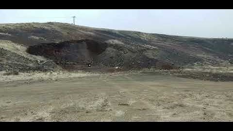 Shooting 1lb of sonic boom tannerite with a 55 gallon barrel over it