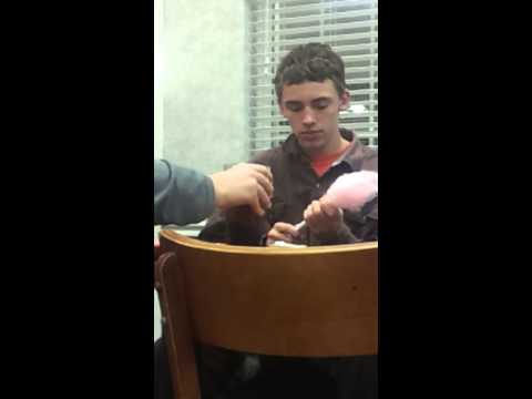 The most adorable guy eating cotton candy