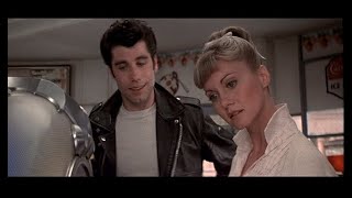 Sandy pretends to ignore Danny at the jukebox -- Olivia Newton-John and John Travolta in Grease