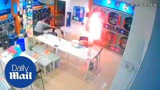 Shocking moment tumble dryer catches fire in Thailand