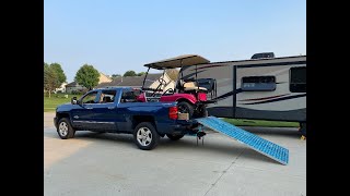 Loading golf cart into truck bed. Should be no problem with this ramp.