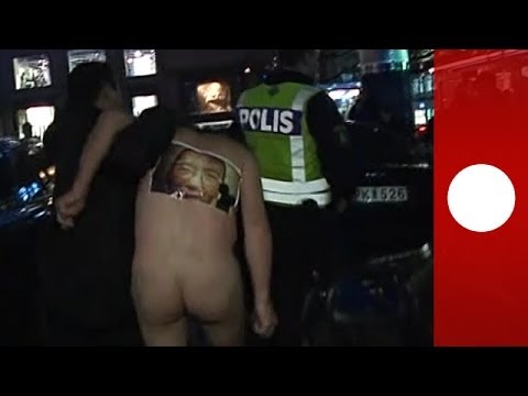 Naked protest in Sweden: Chinese dissidents disrupt Nobel Prize ceremony arrivals