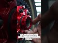 Professional mechanic installing a new custom rear sprocket