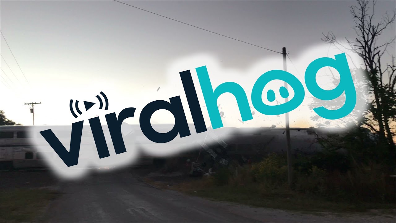 Train Plows Through Car Carrying Semi || ViralHog - YouTube