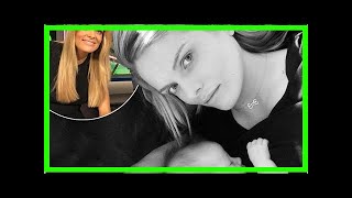Erin Molan poses with her baby after returning to the Footy Show