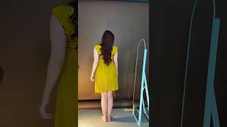 This is a yellow pleated mini dress with a square neckline and ruffled cap sleeves #fashion #dress