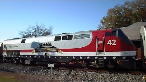 CSX Train Chases Amtraks Veterans Train In Reverse