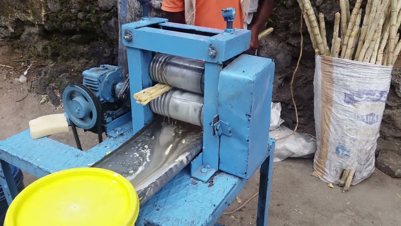How to make fresh sugar cane juice in Zanzibar Tanzania (street food