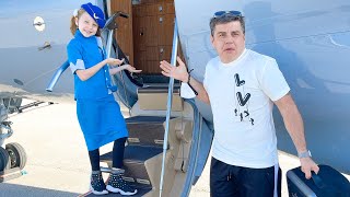 Nastya pretends to be a flight attendant for dad on the plane