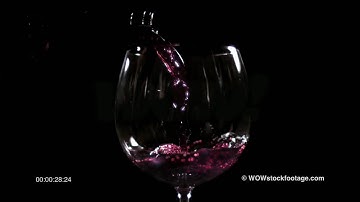 Super slow motion of red wine poured into glass SF0005