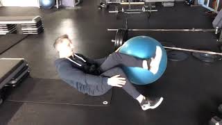 Feet elevated single leg glute bridge on swiss ball