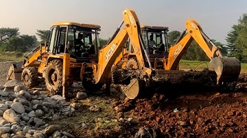 Two JCB Backhoe 3DX Throwing Out Broken Bridge Concrete