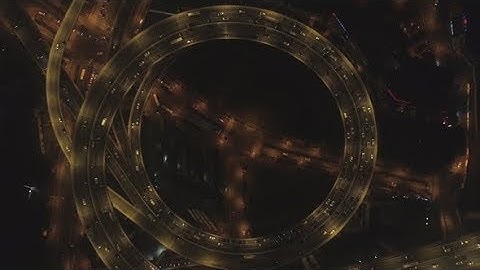 Spiral Illuminated Elevated Nanpu Highway at Night. Shanghai, China. Aerial Vertical View | Stock