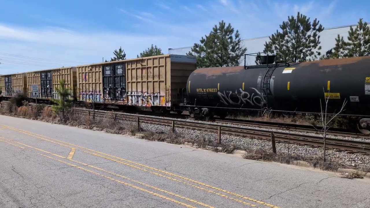 CSX 814 leads a good sized north bound mixed freight down Winslow Street in Fayetteville 2/22/2026