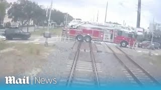 Dashcam footage shows Florida train colliding with a fire truck