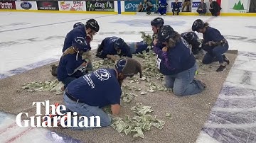 South Dakota teachers scramble for dollar bills to buy classroom supplies in half-time game