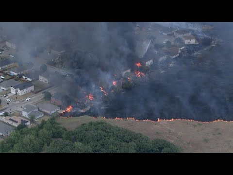 Crews battling growing grass fire in Balch Springs neighborhood; people in nearby hotel evacuated