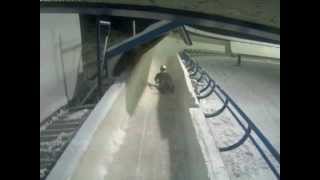 Bobsleigh Brakeman waves at camera after crash