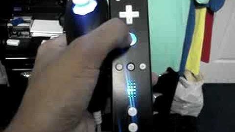 Black Wii Mote modded (A button, Rumble, and nunchuck)