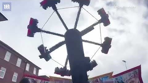 Terrifying moment fairground ride falls apart while in mid-air