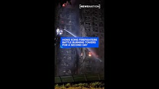Hong Kong firefighters battle burning towers for a second day
