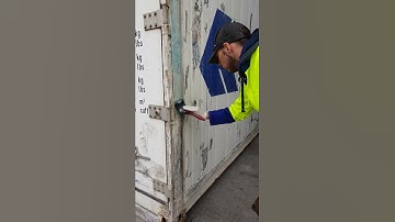 Applying rust converter and primer to refrigerated container prior to painting