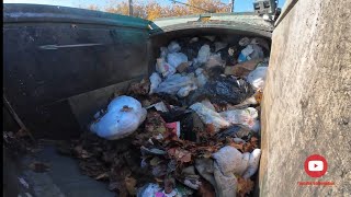 Waste Management front load garbage truck smashing garbage 