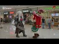 A First Cookie Mascot Gives High Fives To Three Other First Cookie Mascots