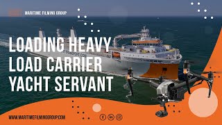 Loading two inland vessels onto the submersible heavy load carrier Yacht Servant