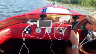 &#39;Rojito&#39; Suzuki 50hp speedboat on the River Great Ouse near Cambridge