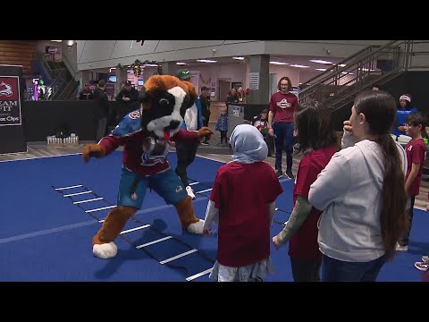 Colorado Avalanche players help train Gust Elementary School students