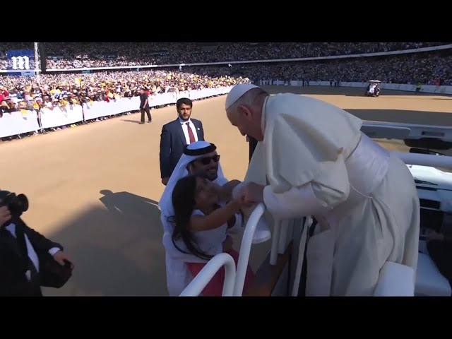 Girl breaks security barriers to run to the Pope in UAE class=