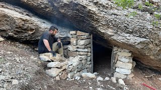 Building a shelter with a fireplace under the mountain