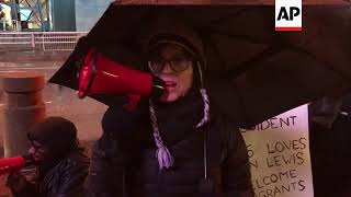 Protest in Atlanta as Trump arrives for big game