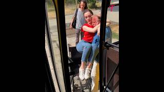Bus driver carries paraplegic girl onto bus paralyzed girl lifting transferring