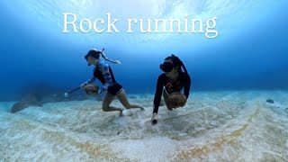 Rock running 30 feet under water. 