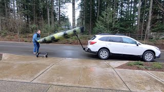 Loading Hobie Pro Angler 12 kayak on top of a car