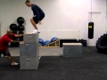 Cj performing box jumps during his session at strengthnu